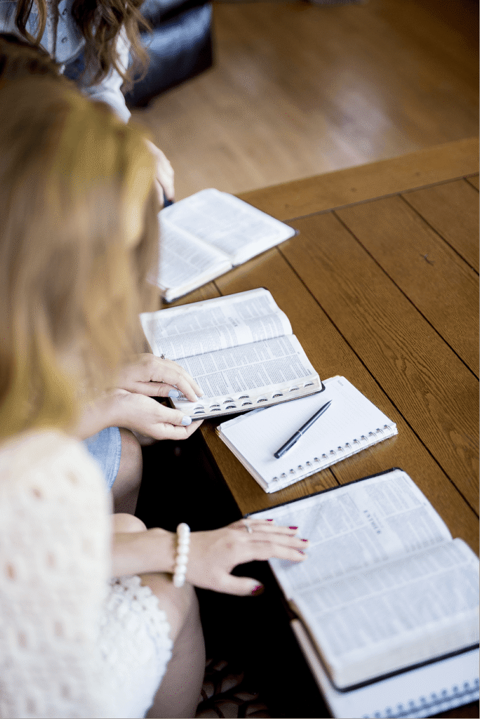 High angle vertical shot of women reading the Bible
